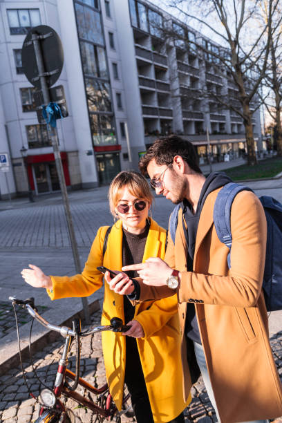 istock Man and woman looking some information at phone 1166977567
