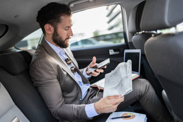 istock Business Executive Traveling by Car 1166977983