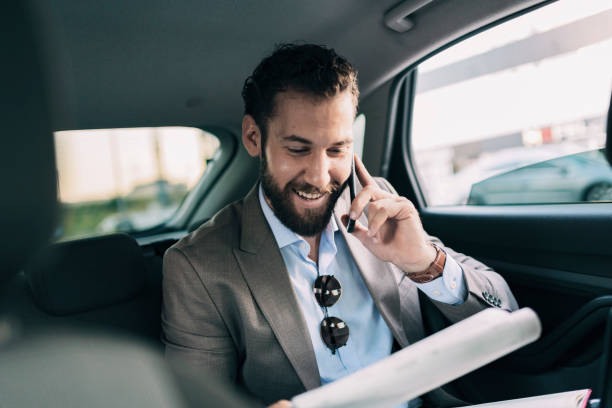 istock Business Executive Traveling by Car 1166978086