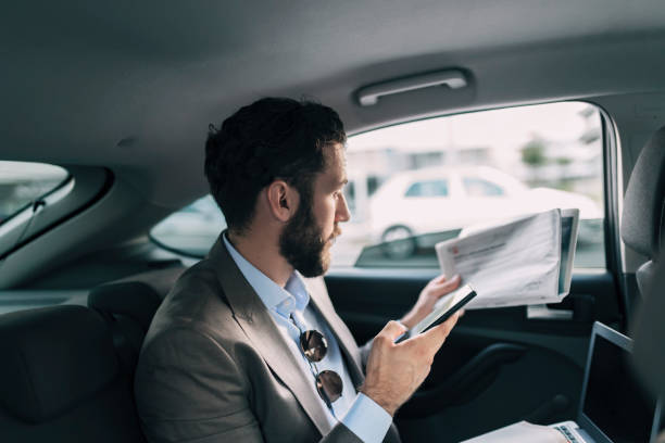 istock Business Executive Traveling by Car 1166978722