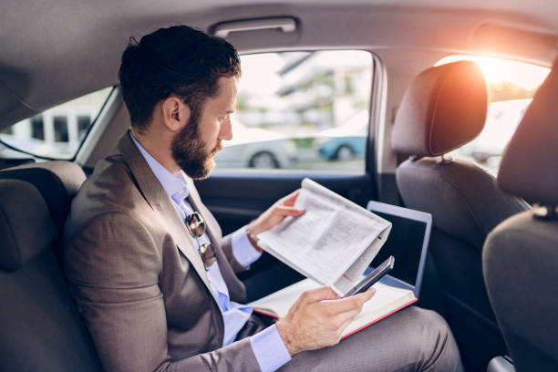 istock Business Executive Traveling by Car 1166978880