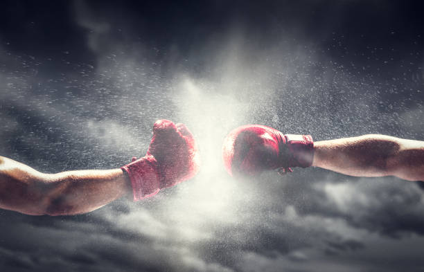 istock Two boxing gloves punch. Box and fight 1166979599