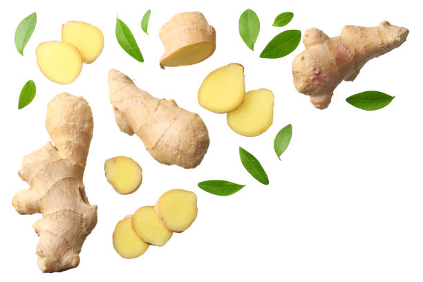 istock sliced ginger with leaves isolated on white background top view 1166979619