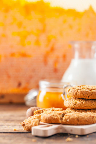 istock Oatmeal cookies with milk and honey 1166982497