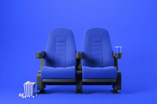 istock Two blue cinema chairs on blue 1166983328