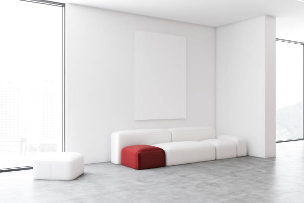 istock White living room corner with sofa and poster 1166983393