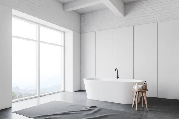 istock White loft bathroom corner with tub 1166983465