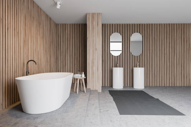 istock Wooden bathroom interior, tub and double sink 1166983608