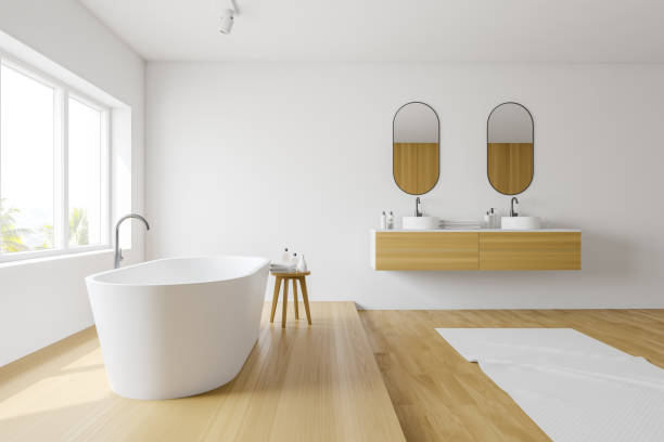 istock White bathroom interior with tub and sink 1166983610