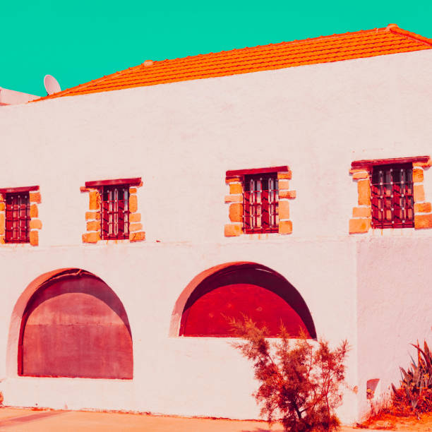 istock Old building in orange style. Tropical town 1166983852