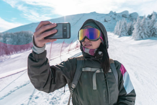 istock Taking photos on winter holiday 1166985914