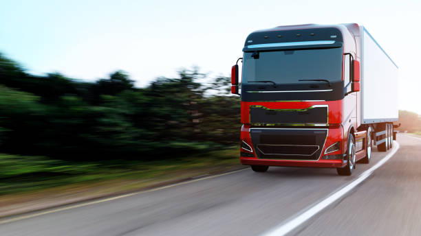 istock semi-truck with trailer driving on road 1166986135