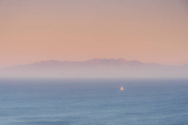 Lonely sailboat near coast of the island of Mykonos