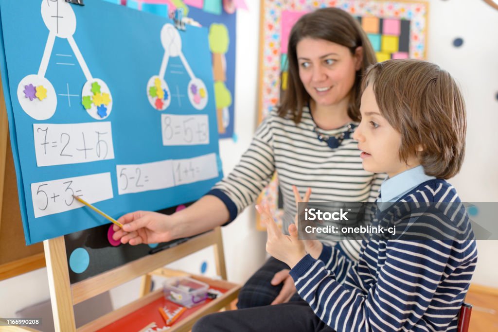 Kinderten Math Solving Kid Solving Math Exercises Stock Photo - Download Image Now - Teaching ...