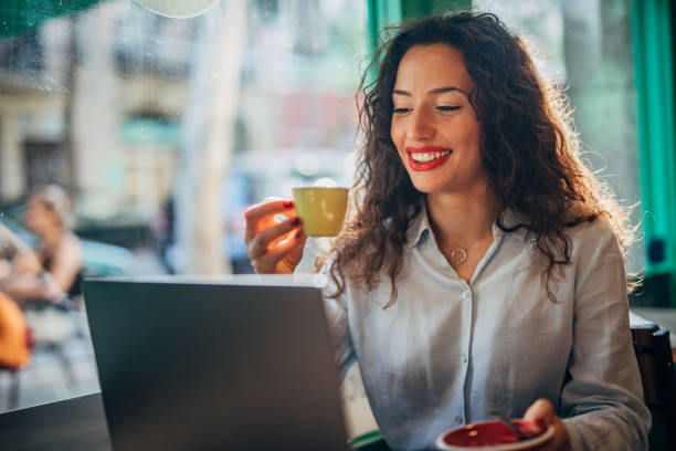 istock Beautiful lady drinking coffee in cafe 1166990209