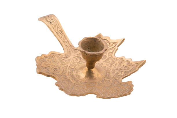 istock Antique brass candle holder isolated on white background 1166990634