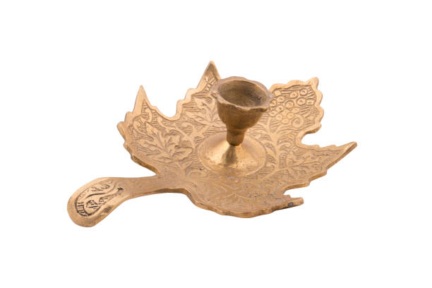 istock Antique brass candle holder isolated on white background 1166990641