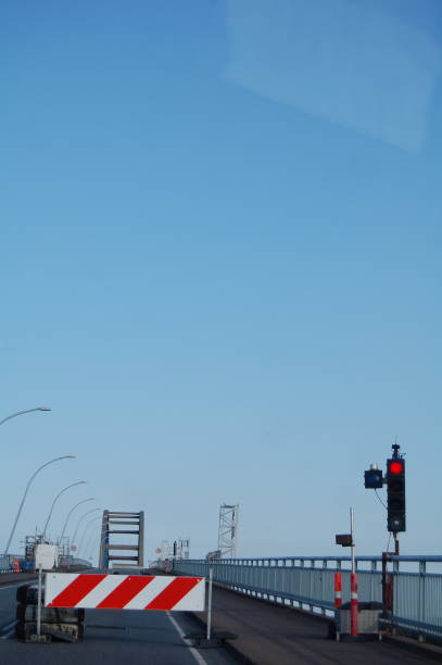 istock Red light and a stop sign on an emty bridge. 1166990718