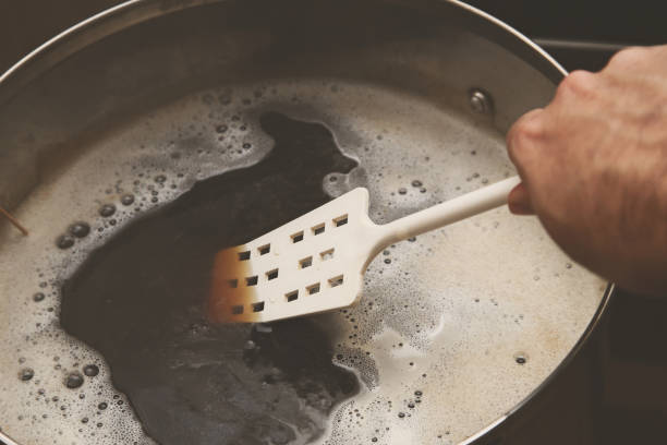 istock Brewing craft beer in a kitchen. Home brewing concept image. 1166990931