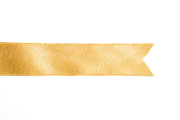 istock Gold ribbon in roll on white background 1166991970