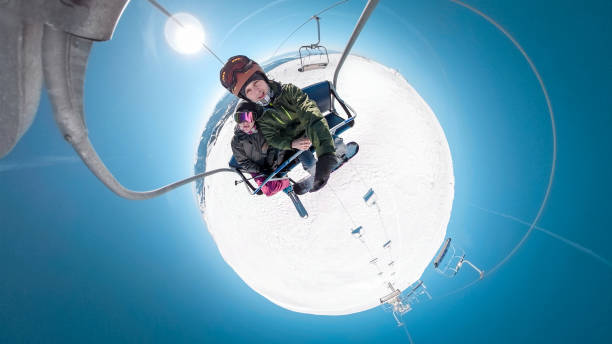 istock Couple in ski lift 1166993218
