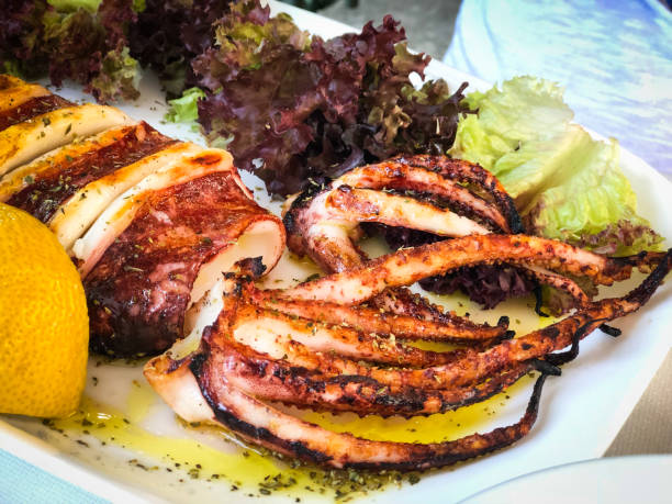 fresh grilled squid with lemon and lettuce