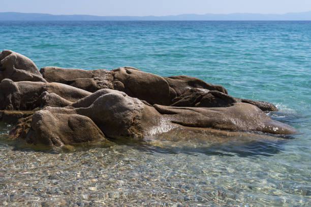 istock Coastal rocks, sea and sky 1166995499