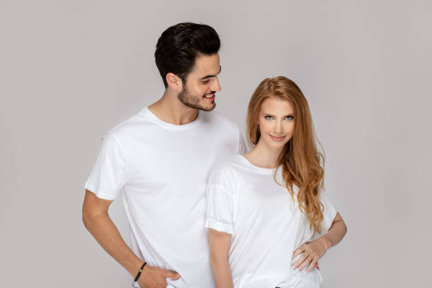 istock Happy youg couple posing together in studio. 1166997171