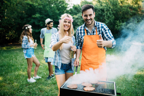 istock Group of friends having fun in nature doing bbq 1166997325
