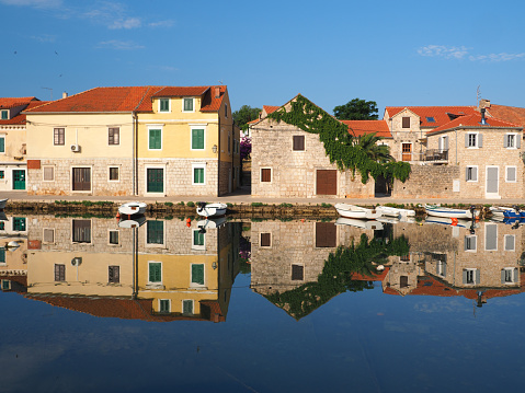Traditional Dalmatian fishing village and marina early in the morning, Hvar Island, Dalmatia, Croatia.  Vrboska is an ideal destination for those who are looking to benefit from the rich monumental heritage and natural beauties of Central Dalmatia islands.