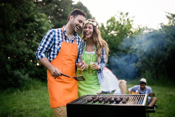 istock Friends having a barbecue party in nature 1166999464