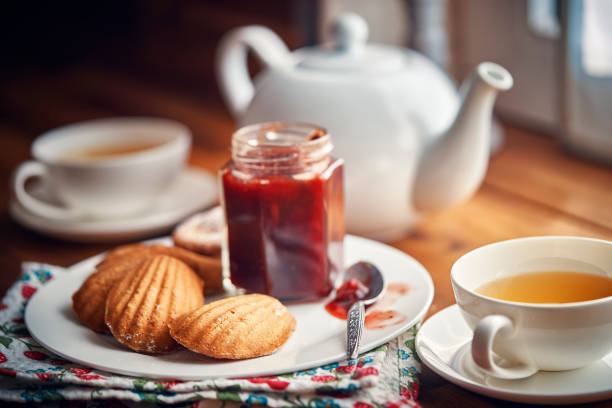 Madeleine Cakes with Marmalade and Cup of Tea