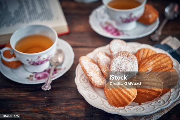Madeleine Cakes Served With Cup Of Tea Stock Photo - Download Image Now - Tea - Hot Drink, Cookie, Cake