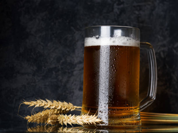 istock Beer mug with light beer on dark background 1167002353