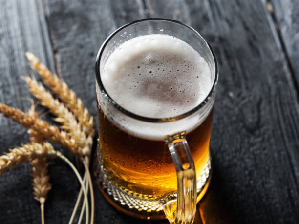 istock Beer mug with light beer on dark background 1167002451
