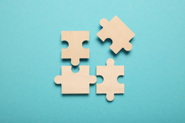istock Wooden puzzles, solving problems in business. Innovation and teamwork in company 1167005987
