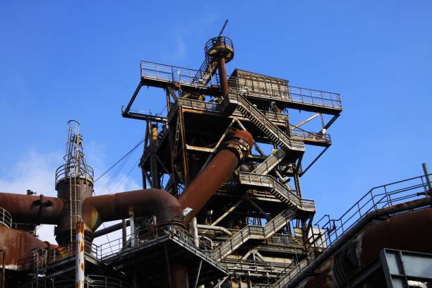 istock Low angle view on stairways into deep blue sky at corroded tower with rusty pipeline 1167006615