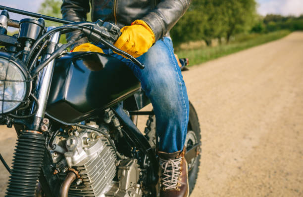 istock Man riding custom motorbike 1167008456