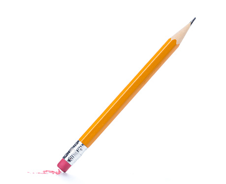 A pencil eraser removing a written mistake on white surface