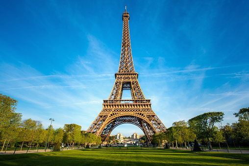 Landscape panoramic view on the Eiffel tower and park during the sunny day in Paris, France. Travel and Vacation concept.