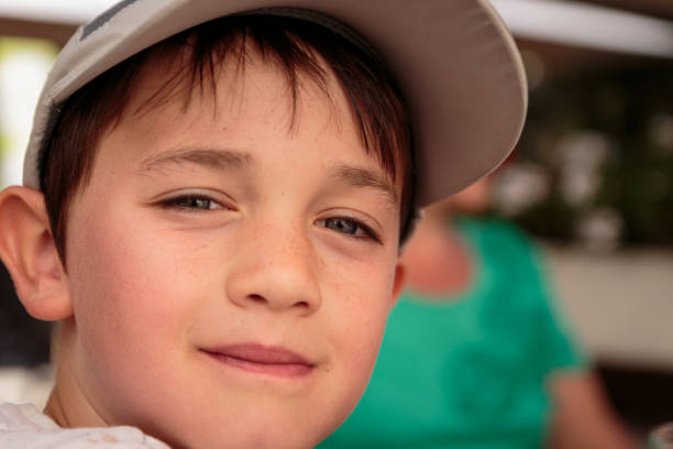 Close-up of a boy in winter clothing wearing a parka and a tuque.