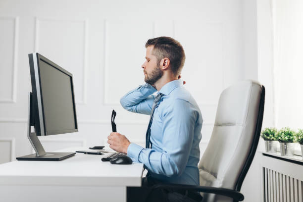 istock Office worker with pain from sitting at desk all day 1167013062