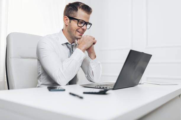 istock Successful businessman working in his office 1167014238