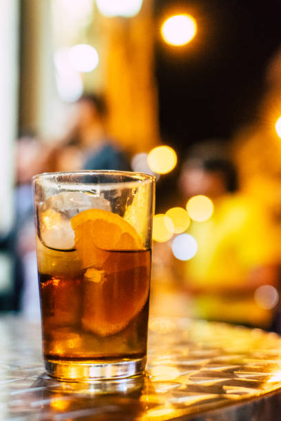 istock Classic Cocktail with Ice and Orange on the bar table 1167017951