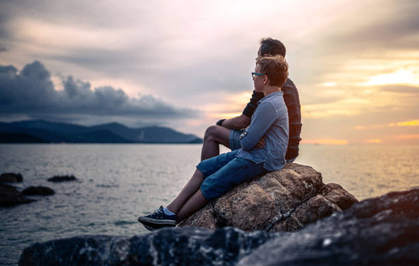 istock Father and son watching sunset at sea. Ko Samui. Thailand 1167023914
