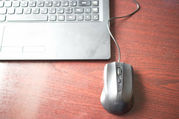 istock laptop and black mouse on office desk 1167023931