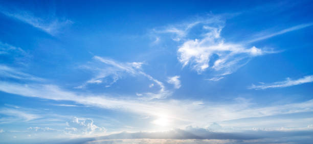 Majestic sun and clouds on blue sky