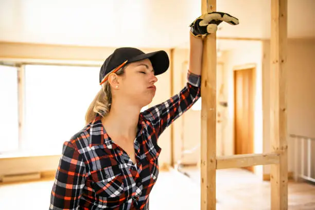woman worker in the carpenter workroom tired problem