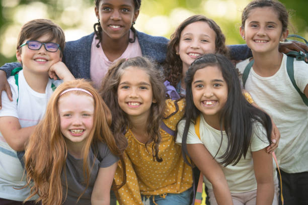 istock Back to school: Portrait kids smiling outside 1167029115