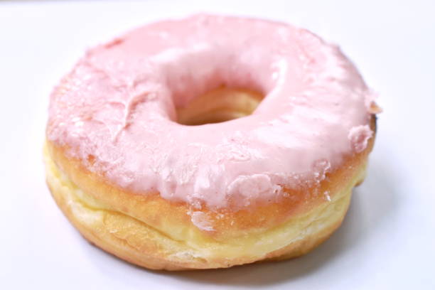 istock strawberry cream donuts on white background 1167031581